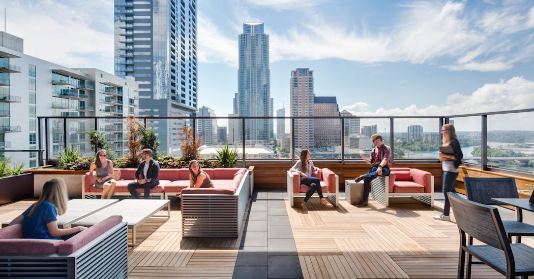 Amenities in offices today may include a bar, outdoor space or even a broadcasting amphitheater, all with technology capabilities where workers can gather.