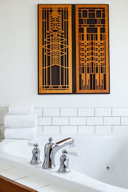 Artwork featured in the bathroom suite was inspired by Frank Lloyd Wright's iconic, geometric forms. Artwork featured in the bathroom suite was inspired by Frank Lloyd Wright's iconic, geometric forms.