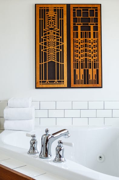 Artwork featured in the bathroom suite was inspired by Frank Lloyd Wright&apos;s iconic, geometric forms.
