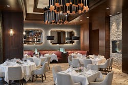 1832 Steakhouse. The steakhouse envelops guests in a luxurious palette of warm woods, crisp accents, and a culturally-inspired carpet. Large, halo-lit mirrors throughout the space help visually widen the narrow dining area.
