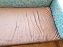 Damage to polyurethane cushions at a military hospital after about 2 years of cleaning with various wipes and disinfectants.