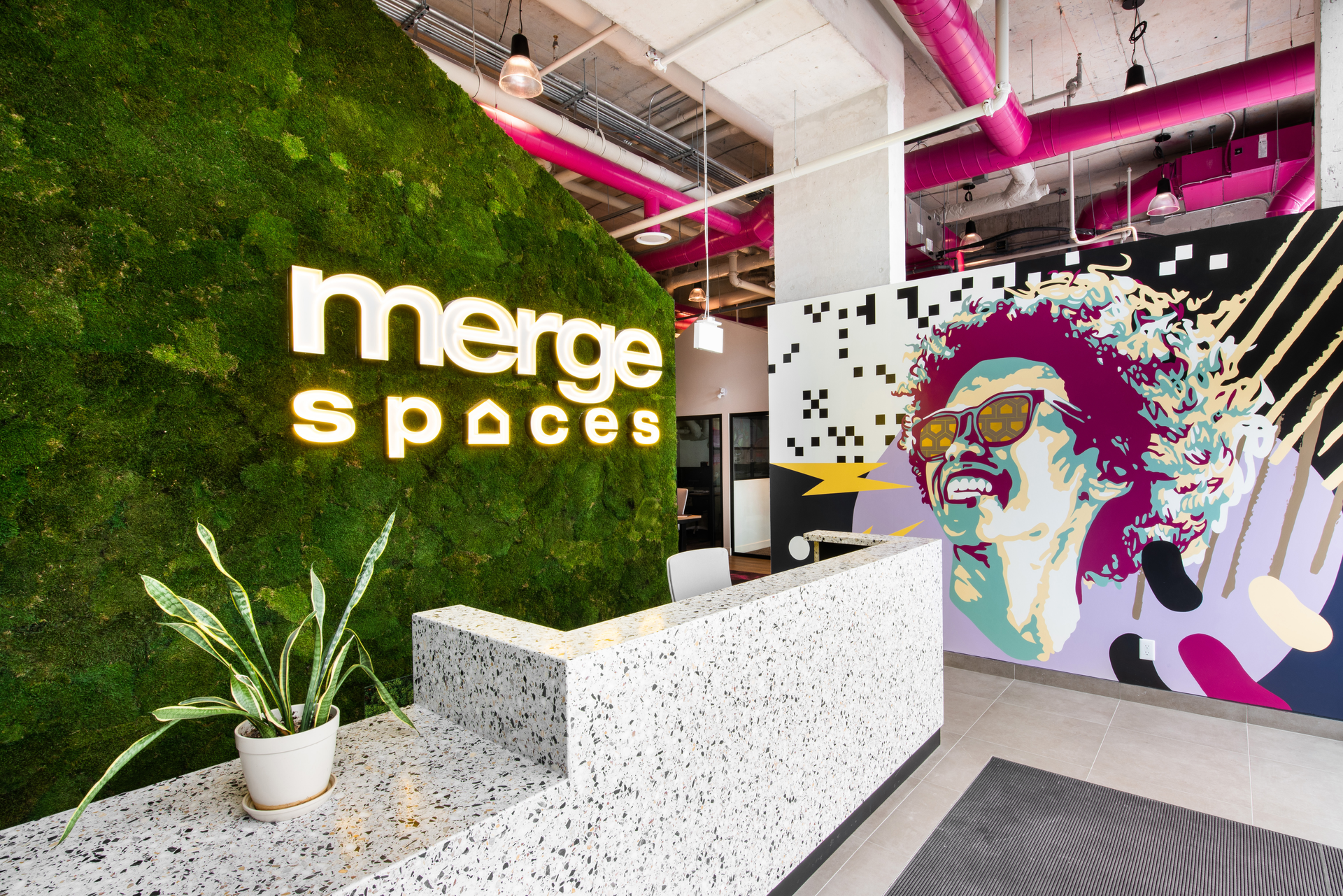 Designed by RAW Architects, a bright magenta color is carried throughout Merge Spaces, infusing the environment with a creative, bold and vibrant energy.