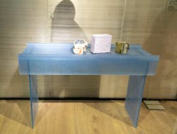 A blue glass table from Glas Italia, designed by Patricia Urquiola.
