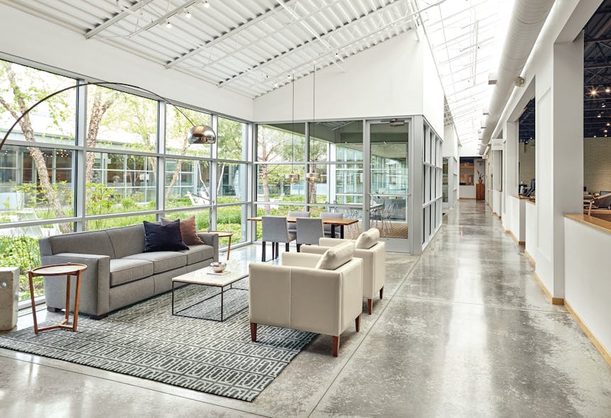 Room &amp; Board&rsquo;s headquarters feature a wraparound design that allows a gorgeous view of the center courtyard and lush vegetation from all four angles within the office.