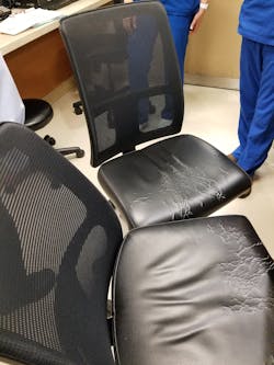The damaged chairs that an Infection Control Director asked a designer to have removed. A new nurse had directed the staff to wipe down the chairs several times per day for three months, causing all cushion vinyl to split and crack, allowing liquids to penetrate through to the cushion.