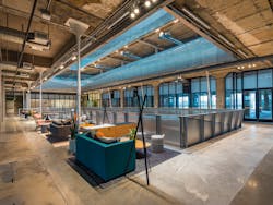 The design team at Gensler preserved many original materials, including open ceilings with wood panels and exposed concrete structure, to honor the raw and industrial vibe of the structure that had been hidden by previous renovations.