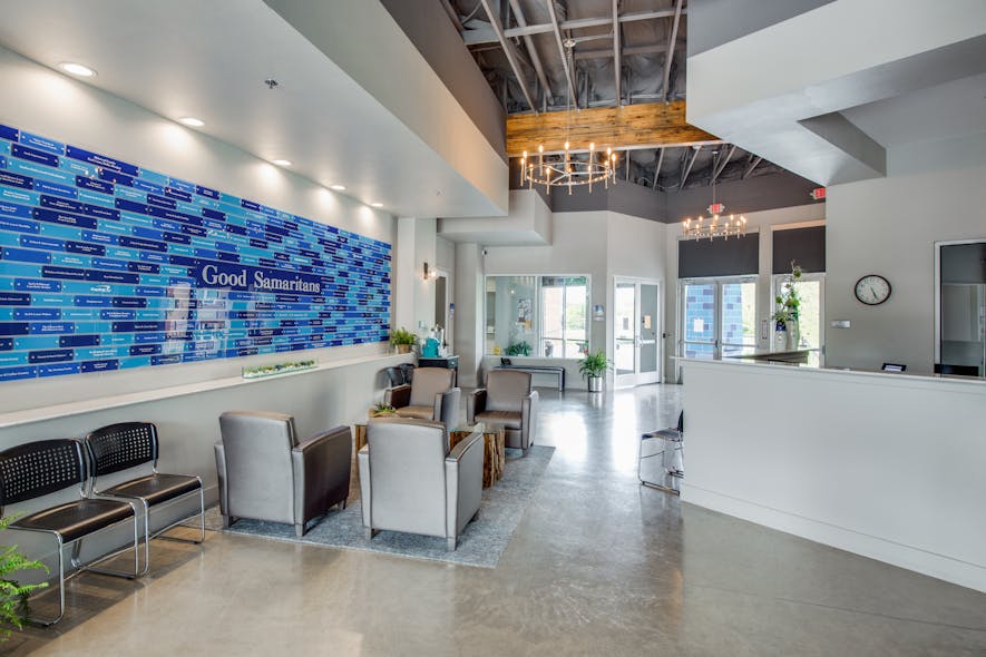 The Samaritan Inn&apos;s blue color is incorporated throughout the project, from the blue wainscot wrapping around each building to the Good Samaritan brick wall in the lobby paying homage to its generous supporters.