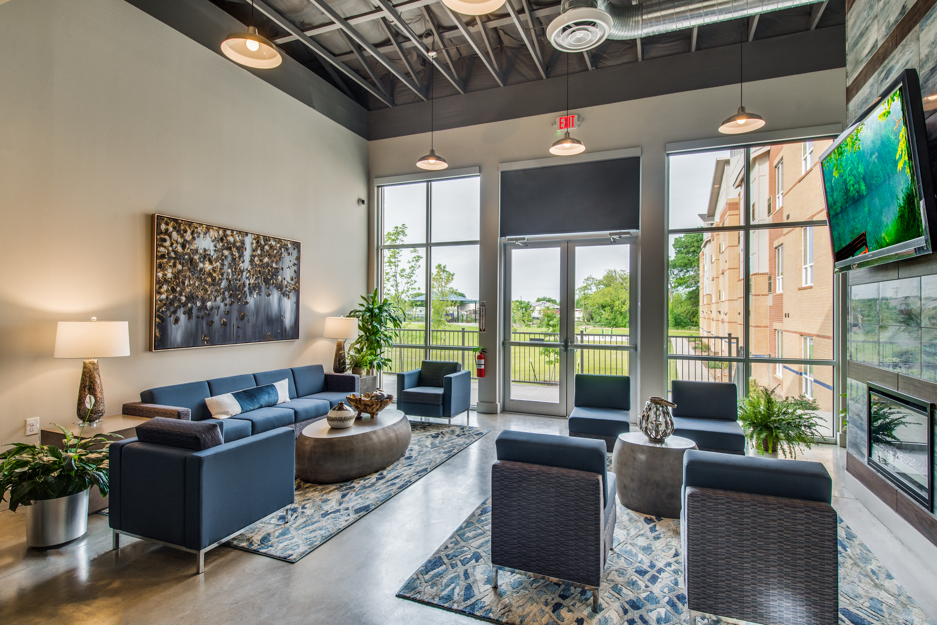 DBA Architects kept costs low by utilizing wood framing in lieu of concrete and steel; stained concrete flooring in place of more expensive finishes; and exposing the roof rafters which eliminated costly ceiling systems.