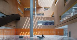 On the main level, a grand central atrium welcomes guests into a vast yet warm and inviting atmosphere of bamboo, oak, and terrazzo. On the main level, a grand central atrium welcomes guests into a vast yet warm and inviting atmosphere of bamboo, oak, and terrazzo.