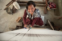 Custom-designed Julie Dasher Rugs are woven with sustainable materials by women in South Asia who are paid livable wages to improve their lives.