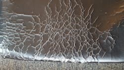This photo shows cracking and delaminating of a coated fabric after several months of being cleaned with bleach wipes 3 &ndash; 4 times per day.