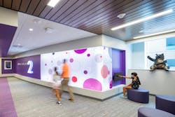 Distinct colors and shapes were designed for each floor to engage children, create a light, playful environment and serve as a wayfinding tool. Distinct colors and shapes were designed for each floor to engage children, create a light, playful environment and serve as a wayfinding tool.