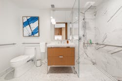 To ensure continuity of design for this barrier-free bathroom at the Maplewood Senior Living Center, Infinity Drain’s linear Tile Insert Frame was installed. To ensure continuity of design for this barrier-free bathroom at the Maplewood Senior Living Center, Infinity Drain’s linear Tile Insert Frame was installed.