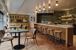 The tasting room&apos;s private event space is intimate and residential in feel, color and layout. Rectangular bistro tables also give guests a view of the bustling neighborhood below.
