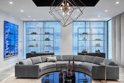 Accessories were carefully curated for metal shelving in the client one-to-one meeting area in order to perpetuate a private, residential living room scene.