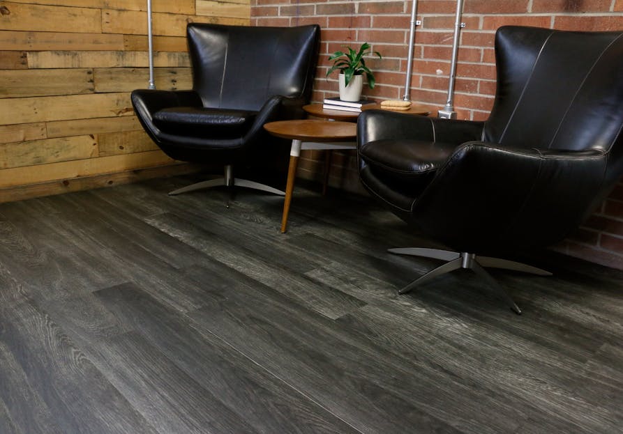 Ecore&apos;s Heritage Motivate flooring is a performance vinyl tile (PVT) that offers premium, structure-borne acoustical performance related to IIC and STC testing, as well as the in-room acoustical characteristics typically relegated to soft surfaces like carpet.