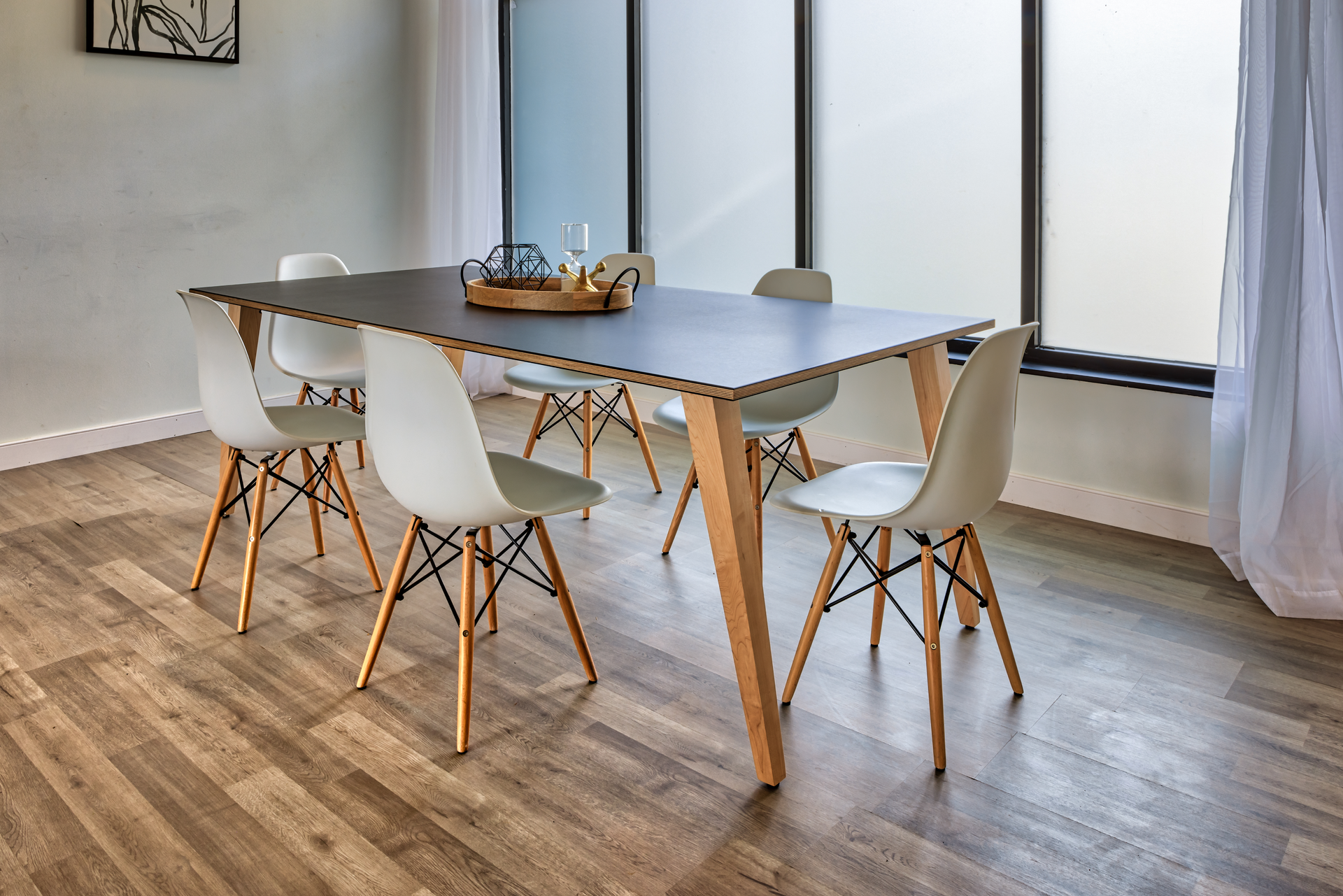 The EarthPly slant leg table design.