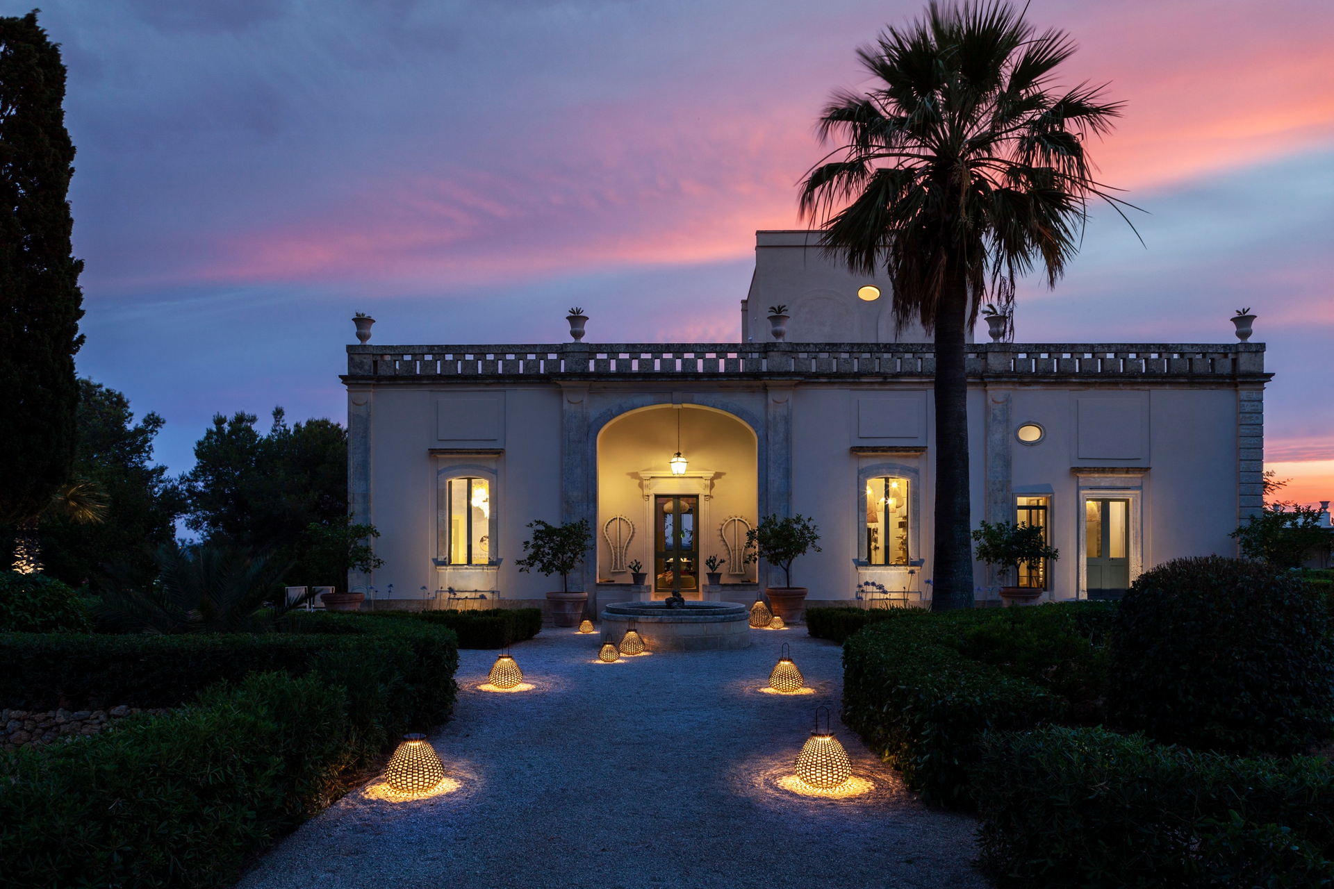 The Sparkler lamp illuminates a walkway at a home.