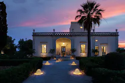 The Sparkler lamp illuminates a walkway at a home.