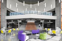 The rotunda offers a variety of seating options and collaboration spaces at the Francis Tuttle Danforth Campus. Pendant lighting illuminates the space, adjusting to the natural light shining through the clerestory windows.