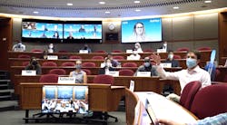 Harvard Business School staff demos hybrid classroom technology during the early days of the pandemic. Harvard Business School staff demos hybrid classroom technology during the early days of the pandemic.