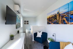Shipping containers offer a stylish studio apartment for Fisk University students. A kitchenette, private bath and study area are highly desirable amenities.