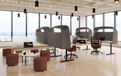 The Hoodie Screen is a curved enclave that attaches to desks to create a private yet welcoming space.