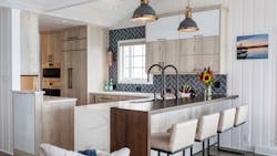 Designer Joyce Zuelke, CKBD of Geneva Cabinets, designed a flat grain wood pastore waterfall countertop for a seamless flow. Designer Joyce Zuelke, CKBD of Geneva Cabinets, designed a flat grain wood pastore waterfall countertop for a seamless flow.