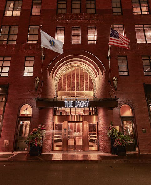 The entrance to The Dagny Boston welcomes guests to a historic Art Deco building reimagined by Hirsch Bedner Associates Los Angeles into a hotel.