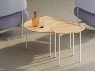 The Posie table is available in three sizes. These nesting tables have a round, recessed top within a teardrop outline.