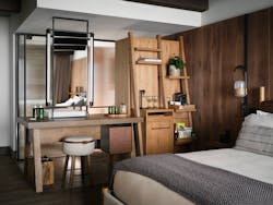 The vanity, mini bar and closet can be accessed from both bathroom and bedroom side of the guest room, inspired by a large farm table that all can easily surround. The vanity, mini bar and closet can be accessed from both bathroom and bedroom side of the guest room, inspired by a large farm table that all can easily surround.