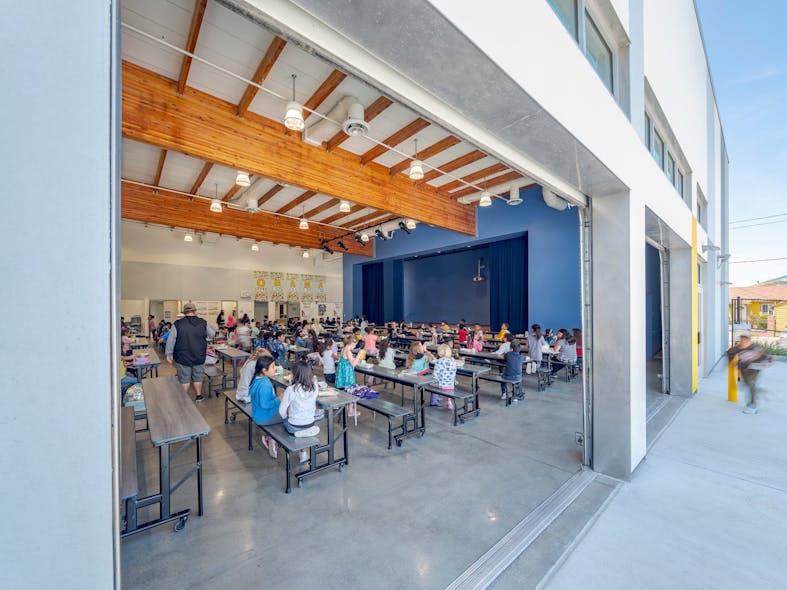 The Multipurpose Room &amp; Dining Commons has two east-facing operable garage doors and hosts breakfast, lunch and dinner daily for students.