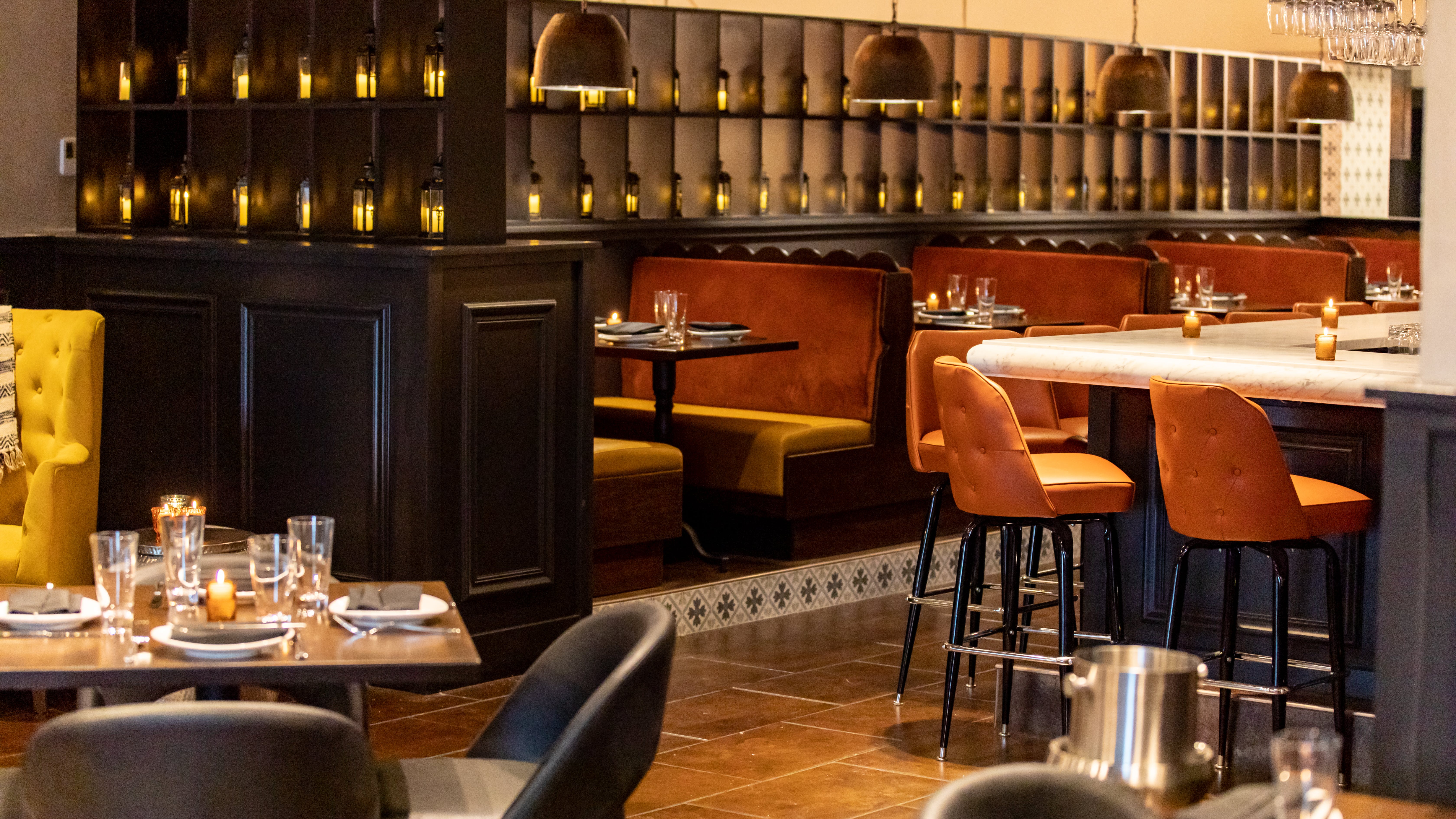 Amada's signature Andalusian-style lanterns line the shelving between the bar and main dining area.