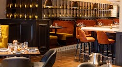 Amada's signature Andalusian-style lanterns line the shelving between the bar and main dining area. Amada's signature Andalusian-style lanterns line the shelving between the bar and main dining area.