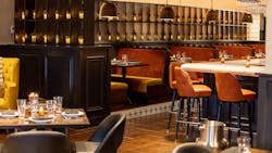 Amada's signature Andalusian-style lanterns line the shelving between the bar and main dining area. Amada's signature Andalusian-style lanterns line the shelving between the bar and main dining area.