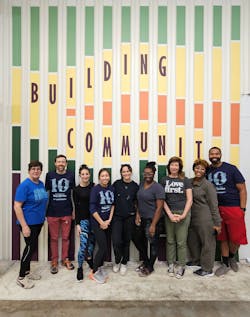 EskewDumezRipple and accompanying firm volunteers paint murals at the New Orleans warehouse for the organization Second Harvest Food Bank during the firm&rsquo;s 10th Anniversary of the Martin Luther King, Jr. Day of Service.