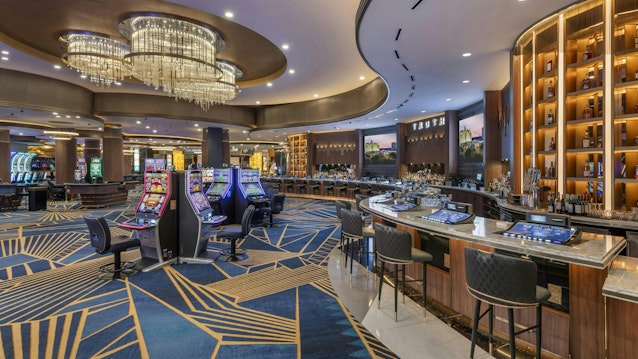 Pequot symbols are interwoven in the geometry of the carpet design at the Woodlands Casino at Foxwoods, honoring Mashantucket Pequot Tribe’s history as the owner and operator of the world’s largest casino resort in rural Ledyard, Conn.