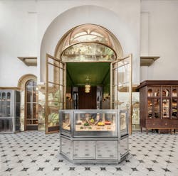 The main display case in the center of the lounge encourages customer interaction with the piece as it has push-pull drawers that allow them to pick out their own cakes. The main display case in the center of the lounge encourages customer interaction with the piece as it has push-pull drawers that allow them to pick out their own cakes.