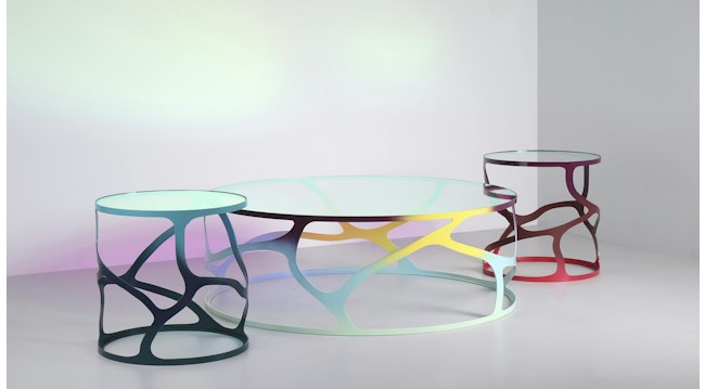 Papillon coffee table and two side tables were inspired by the meandering of butterfly wings.