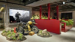 A PUBG motorbike and rocky landscape are found adjacent to the red staircase at the PUBG STUDIOS&rsquo; headquarters in Seoul, Korea. The imagery of the game is also visible on the screen. Kinzo had to incorporate game scenes into the office layout during the project.