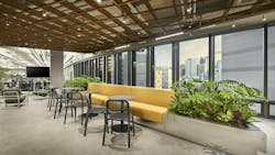 The community space on the ninth floor at KRAFTON’s PUGB STUDIOS’ headquarters features floor-to-ceiling windows around the perimeter that illuminate the warm space. Accented with PUBG green and yellow as well as foliage inspired by the video game, the floor offers a reprieve from work and a place to connect with others. The community space on the ninth floor at KRAFTON’s PUGB STUDIOS’ headquarters features floor-to-ceiling windows around the perimeter that illuminate the warm space. Accented with PUBG green and yellow as well as foliage inspired by the video game, the floor offers a reprieve from work and a place to connect with others.