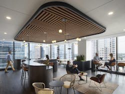 This daylit break room lends a modern coffee bar vibe and references the organization’s brand through lines and circles in the ceiling plan. This daylit break room lends a modern coffee bar vibe and references the organization’s brand through lines and circles in the ceiling plan.