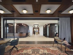 Sophisticated and welcome, the law firm’s entryway greets employees and clients with locally referenced materials like wood, stone and dark metals. Sophisticated and welcome, the law firm’s entryway greets employees and clients with locally referenced materials like wood, stone and dark metals.