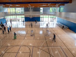 People use the multipurpose gymnasium during the grand opening of the Redmond Senior & Community Center. They can play basketball and pickleball or walk the upstairs track behind the white screen and railing. People use the multipurpose gymnasium during the grand opening of the Redmond Senior & Community Center. They can play basketball and pickleball or walk the upstairs track behind the white screen and railing.