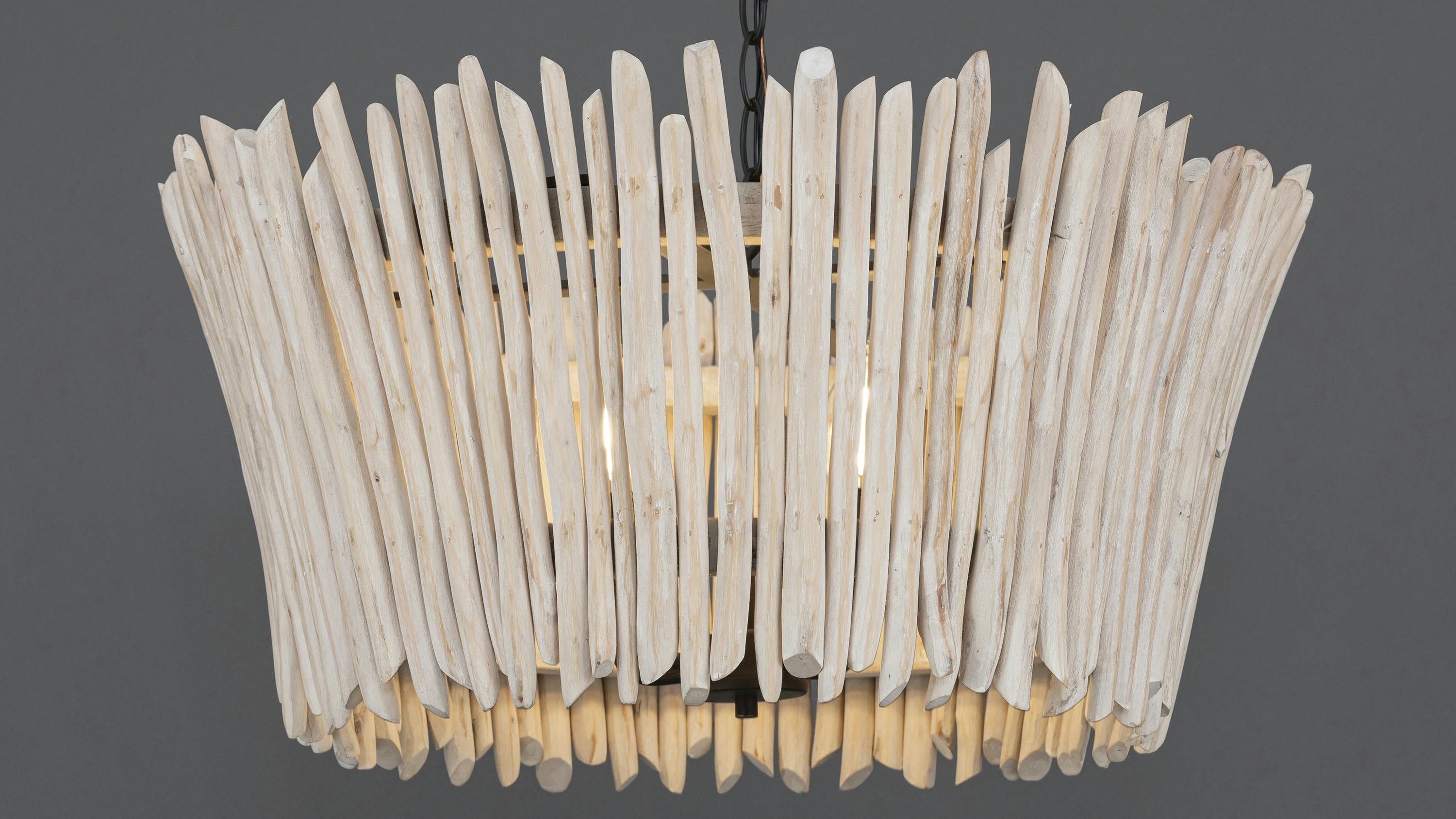 The Baywood chandelier is made of thin eucalyptus branches.