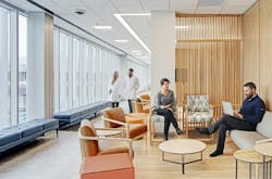 The interior furniture and finishes complement the exterior, using black and rust-colored metal to honor Baltimore’s history and bold pops of Kaiser Permanente’s brand colors to modernize the space. The interior furniture and finishes complement the exterior, using black and rust-colored metal to honor Baltimore’s history and bold pops of Kaiser Permanente’s brand colors to modernize the space.