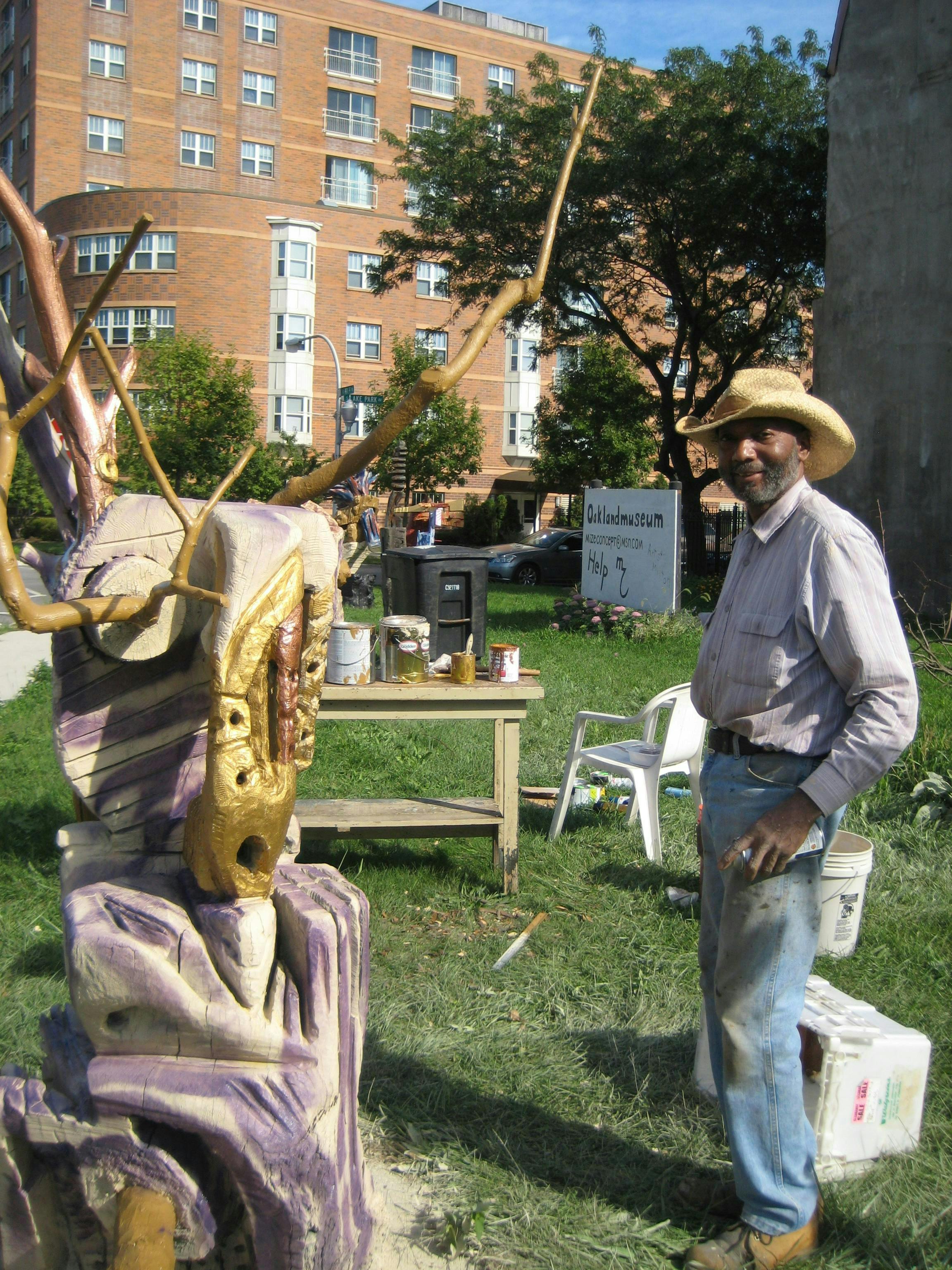 The late self-taught artist and teacher Milton Mizenburg, Jr. working on his sculptures.