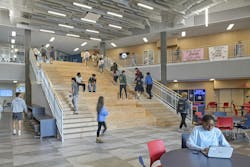 A central staircase in the commons areas links the various floors and serves as a gathering place, an extension of the dining area, and spectator seating for robotics competitions. A central staircase in the commons areas links the various floors and serves as a gathering place, an extension of the dining area, and spectator seating for robotics competitions.