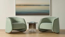 The Abra rocking chair features a curved shape balanced on a solid oak base. The Abra rocking chair features a curved shape balanced on a solid oak base.