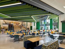 Stantec, which handled architecture design, created an interior template across four of the schools. These two cafeterias demonstrate how the spaces were given an individual look through color choices. Stantec, which handled architecture design, created an interior template across four of the schools. These two cafeterias demonstrate how the spaces were given an individual look through color choices.